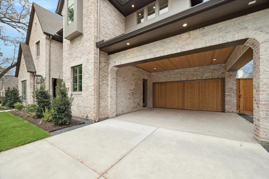 Double driveway leads to full two car portico with wonderful side entrance into MUD room! Oversized custom garage door leads to oversized 2 car garage with EXTRA storage! Double driveway leads to full two car portico with wonderful side entrance into MUD room! Oversized custom garage door leads to oversized 2 car garage with EXTRA storage!