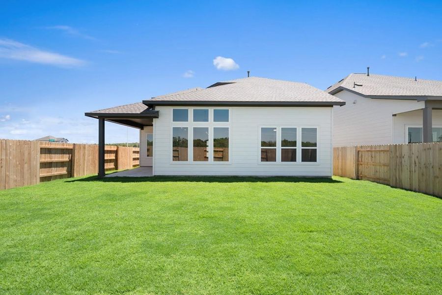 Front exterior of a new home in Lagos Reserve, Manor, TX, highlighting curb appeal (Image 20). Front exterior of a new home in Lagos Reserve, Manor, TX, highlighting curb appeal (Image 20).