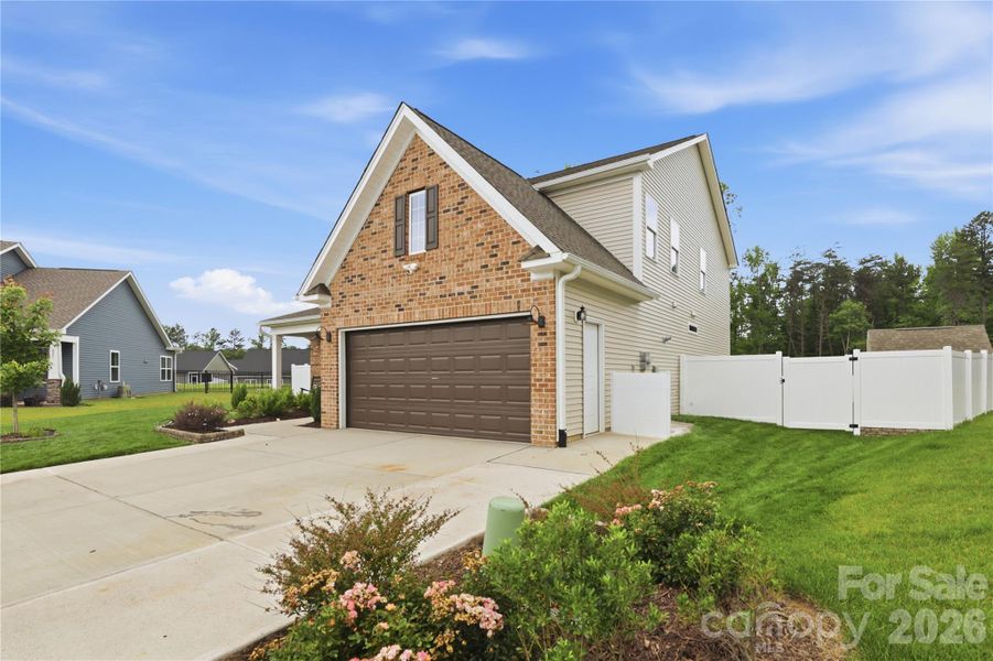 Front exterior of a new home in , Advance, NC, highlighting curb appeal (Image 26).