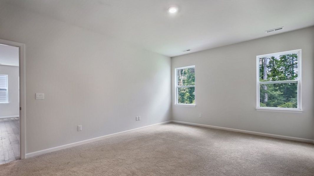 Spacious, unfurnished interior of a new home in The Estates at Edinborough, Gibsonville (Image 21).