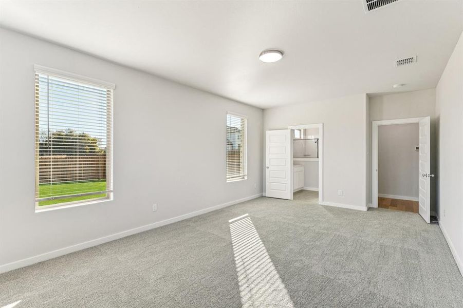 Primary Suite in the Wimbledon home plan by Trophy Signature Homes – REPRESENTATIVE PHOTO