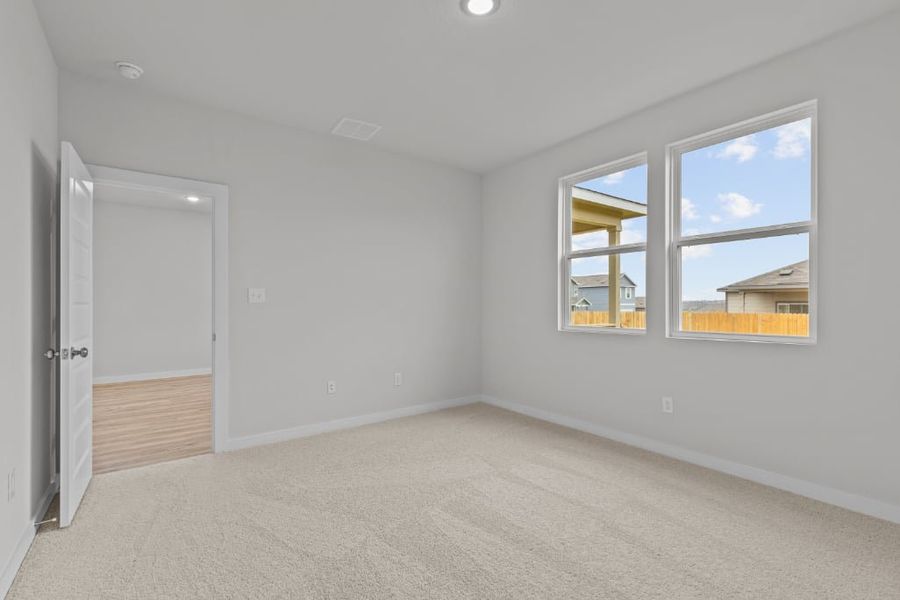 A room with a door and windows.