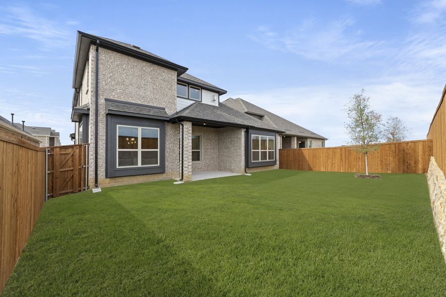 Exterior details and patio area of a home in Brookshire at Legacy Hills, Celina (Image 17).