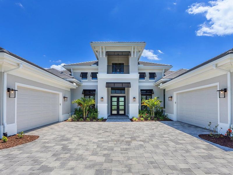 Front exterior of a new home in , Sarasota, FL, highlighting curb appeal (Image 31).