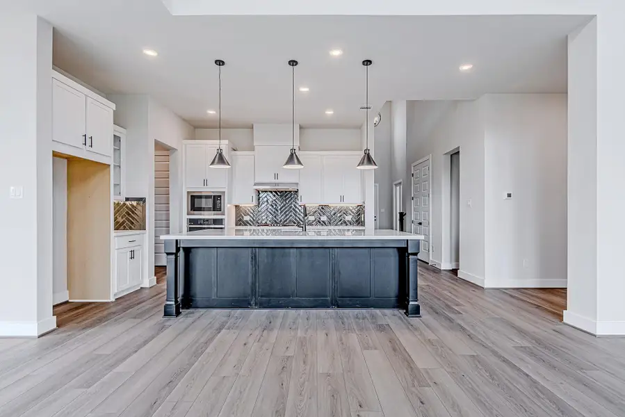 Spacious kitchen layout with ample counter space, perfect for everyday living and entertaining.