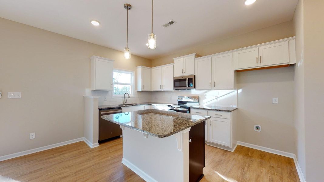 Representative furnished interior of a home built from the Jacob A by JC Jackson Homes,LLC in Heritage Pointe, Newport (Image 8).