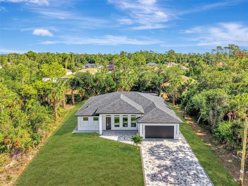 Front exterior of a new home in , North Port, FL, highlighting curb appeal (Image 32).
