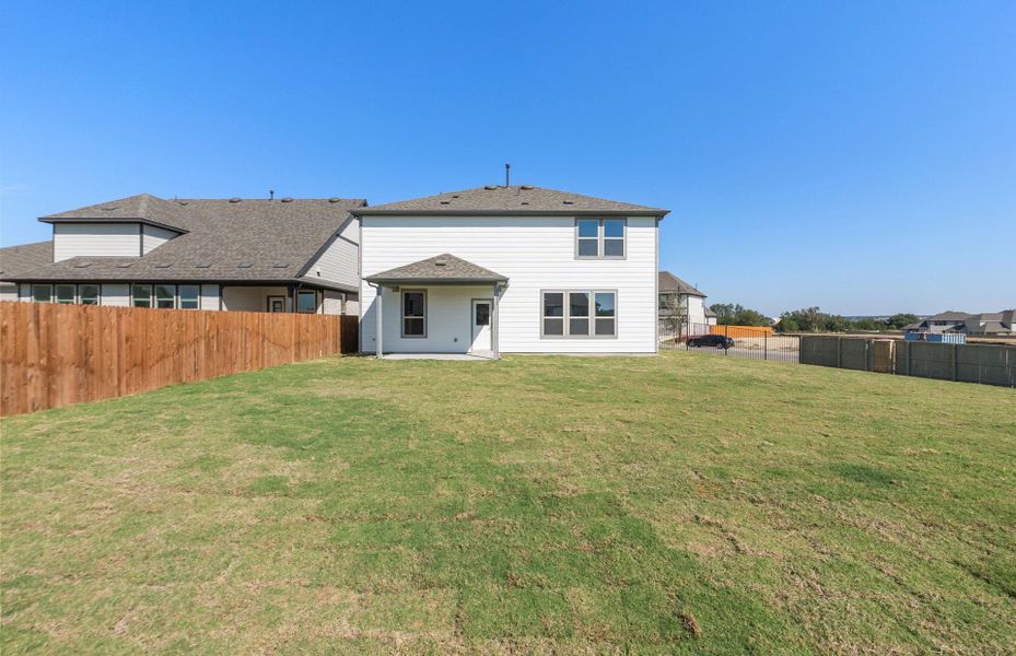 Exterior details and patio area of a home in Saddleback at Santa Rita Ranch, Liberty Hill (Image 18). Exterior details and patio area of a home in Saddleback at Santa Rita Ranch, Liberty Hill (Image 18).