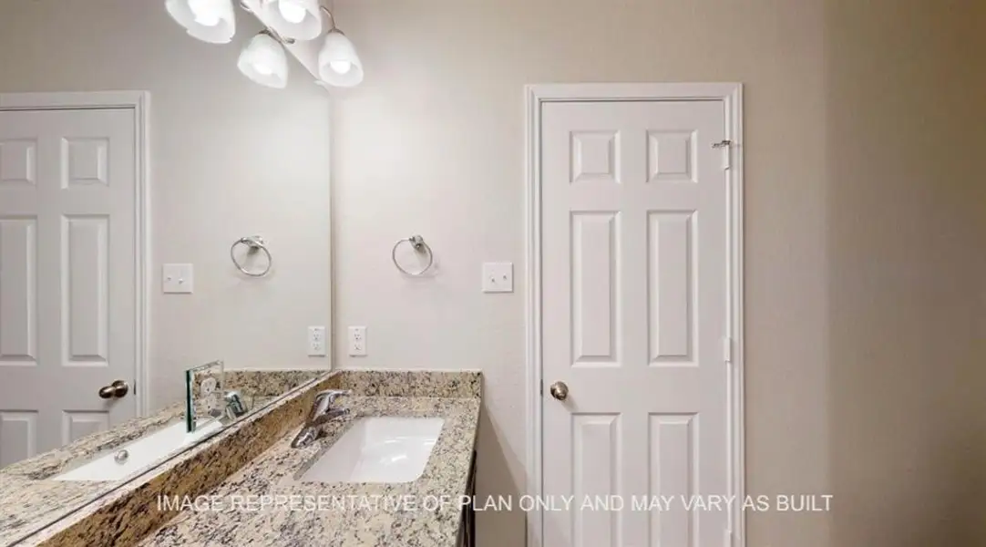 Bathroom with vanity and a chandelier Bathroom with vanity and a chandelier