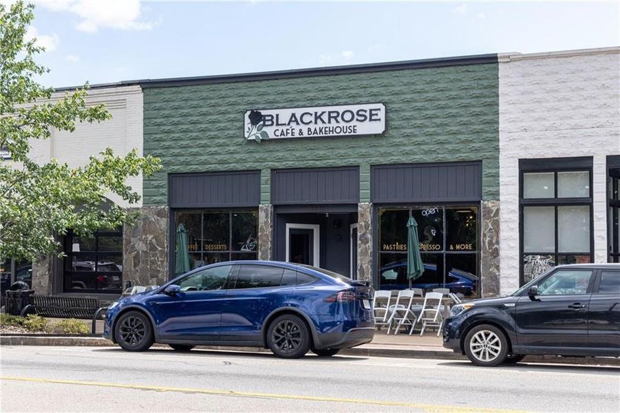Front exterior of a new home in River Oaks, Locust Grove, GA, highlighting curb appeal (Image 2). Front exterior of a new home in River Oaks, Locust Grove, GA, highlighting curb appeal (Image 2).