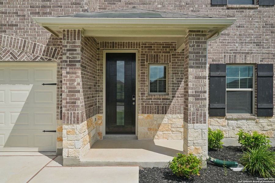 Front exterior of a new home in Legendary Trails - Classic Series, Cibolo, TX, highlighting curb appeal (Image 23). Front exterior of a new home in Legendary Trails - Classic Series, Cibolo, TX, highlighting curb appeal (Image 23).