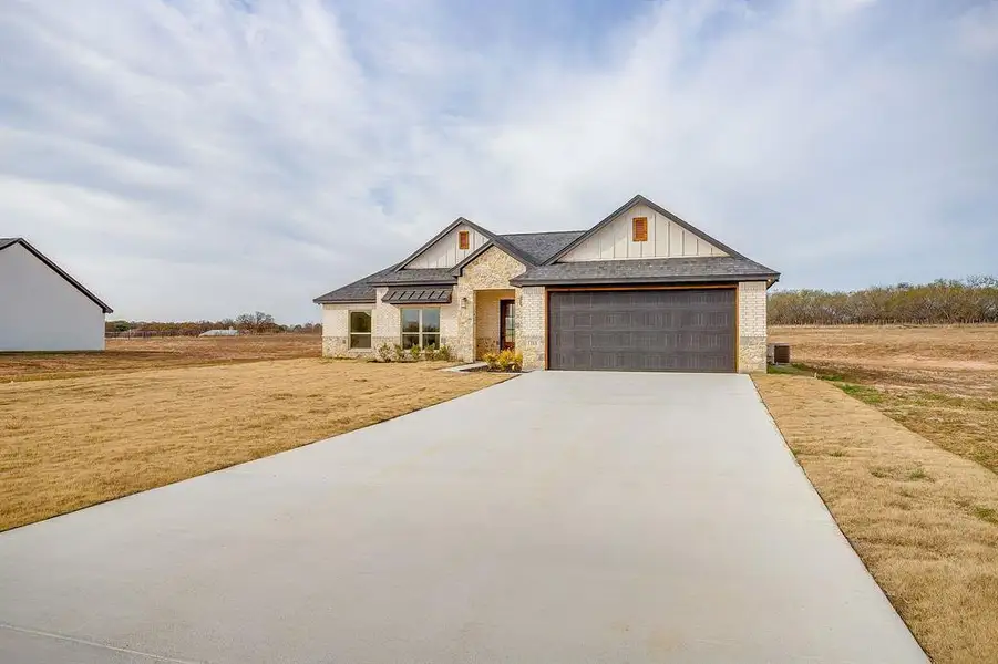 Front exterior of a new home in , Millsap, TX, highlighting curb appeal (Image 20).