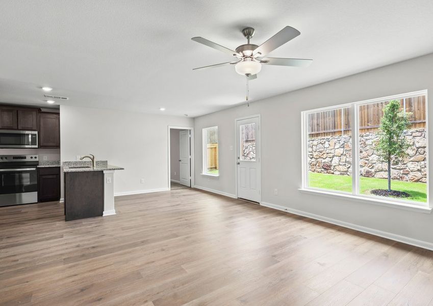 The family room and dining room have large windows that let in great, natural light and backyard views. The family room and dining room have large windows that let in great, natural light and backyard views.