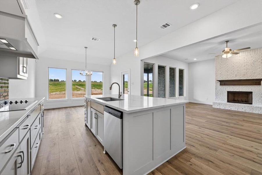 Open concept interior featuring wood-finish flooring throughout