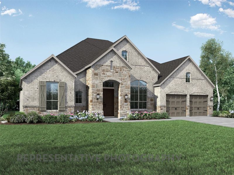 French country inspired facade with brick siding, a front lawn, driveway, and stone siding French country inspired facade with brick siding, a front lawn, driveway, and stone siding
