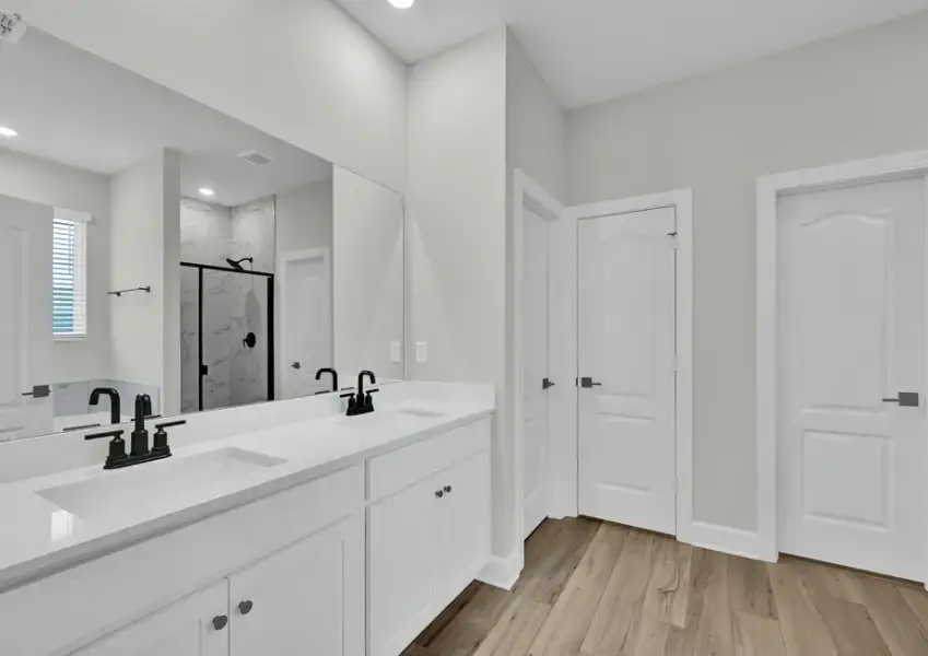 Master bathroom includes a dual-sink vanity