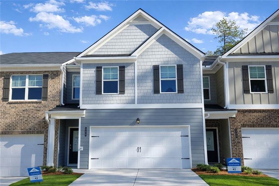 Front exterior of a new home in The Enclave at Whitewater Creek, Union City, GA, highlighting curb appeal (Image 1). Front exterior of a new home in The Enclave at Whitewater Creek, Union City, GA, highlighting curb appeal (Image 1).
