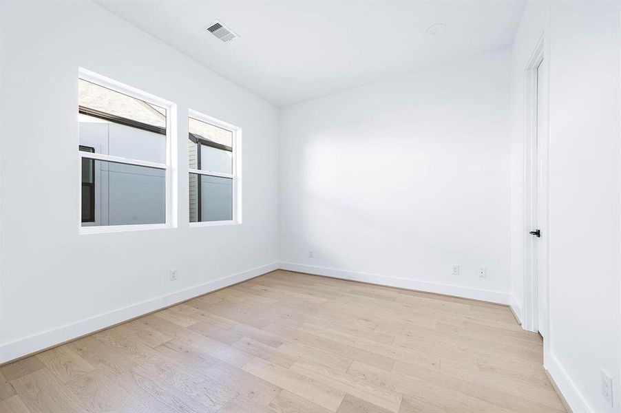 Secondary bedroom on the third floor.