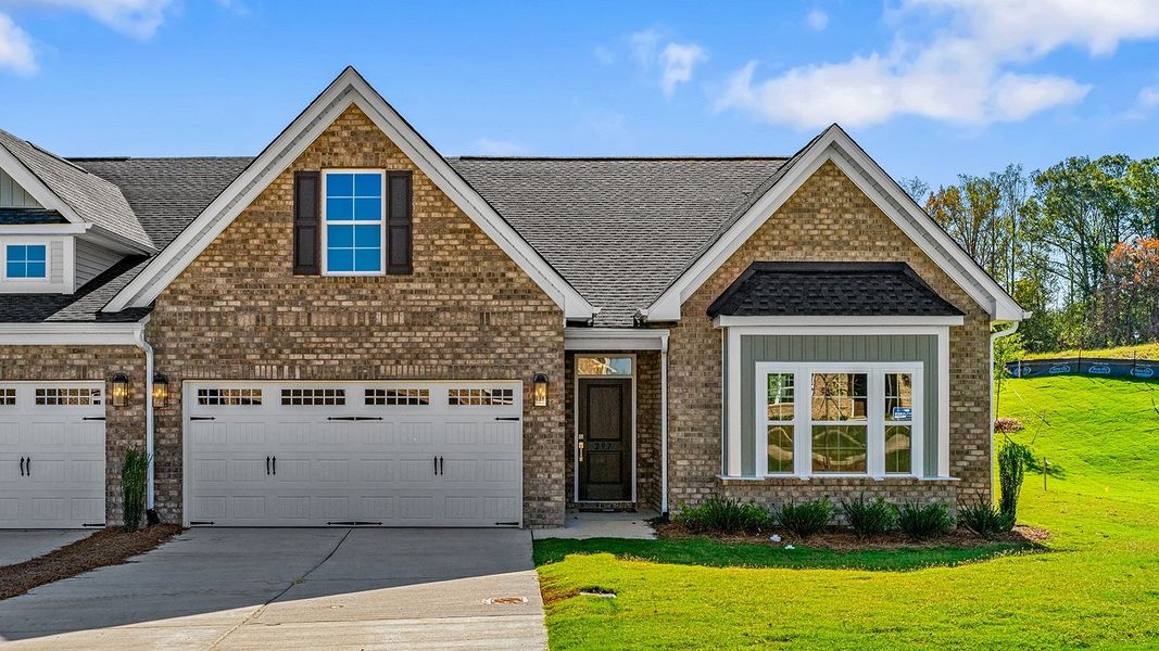 Front exterior of a new home in Fieldstone, Lexington, NC, highlighting curb appeal (Image 1).