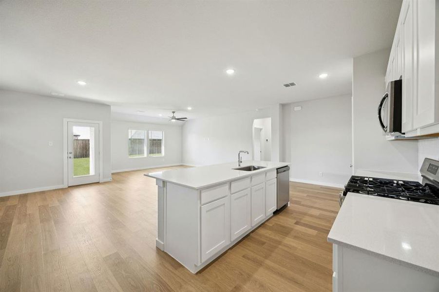 Kitchen in the Heisman home plan by Trophy Signature Homes – REPRESENTATIVE PHOTO