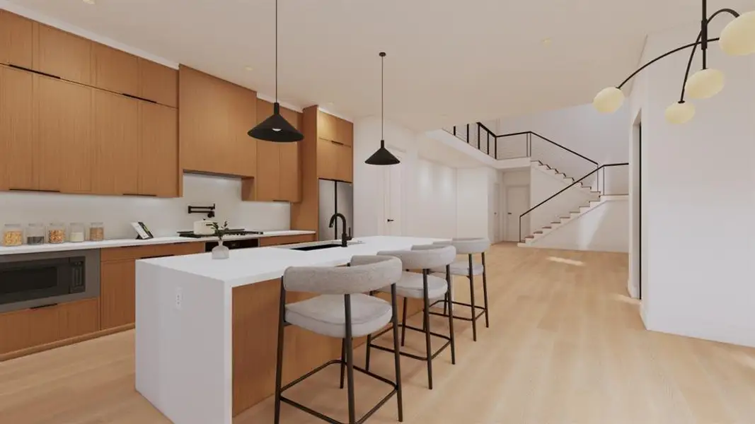 Kitchen featuring an island with sink, a kitchen breakfast bar, and modern cabinets