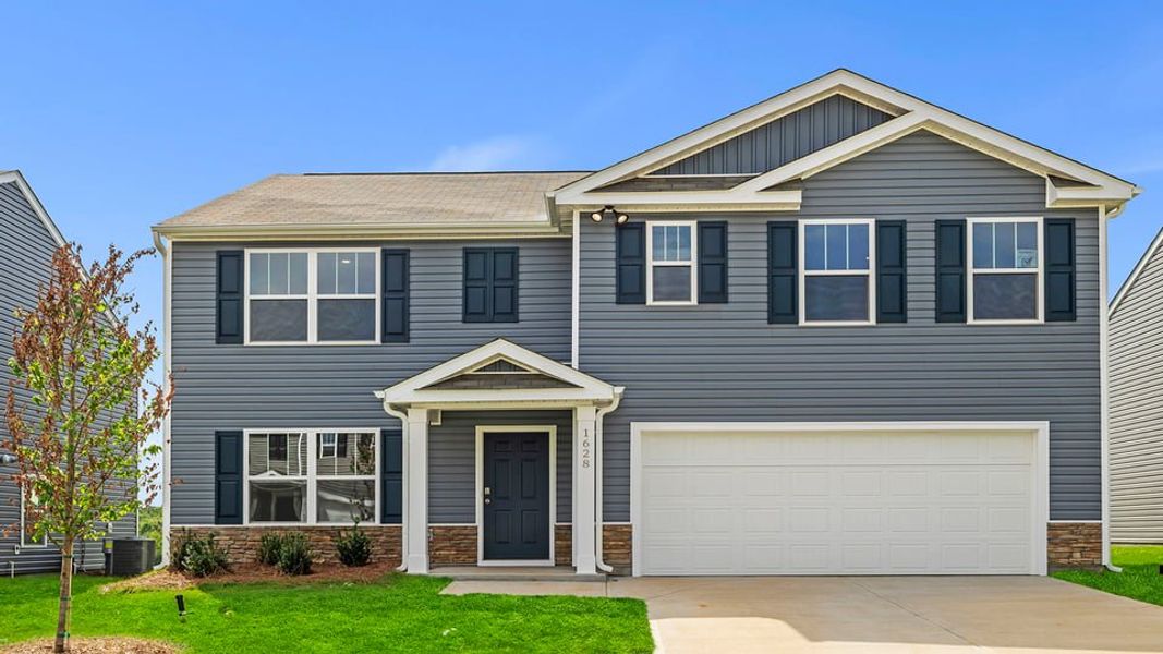 Front exterior of a new home in Harrier Point, Woodruff, SC, highlighting curb appeal (Image 1). Front exterior of a new home in Harrier Point, Woodruff, SC, highlighting curb appeal (Image 1).