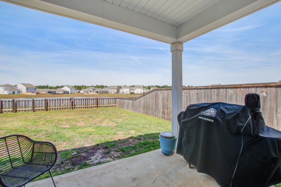 Exterior details and patio area of a home in Pine Hills at Cane Bay, Summerville (Image 4).