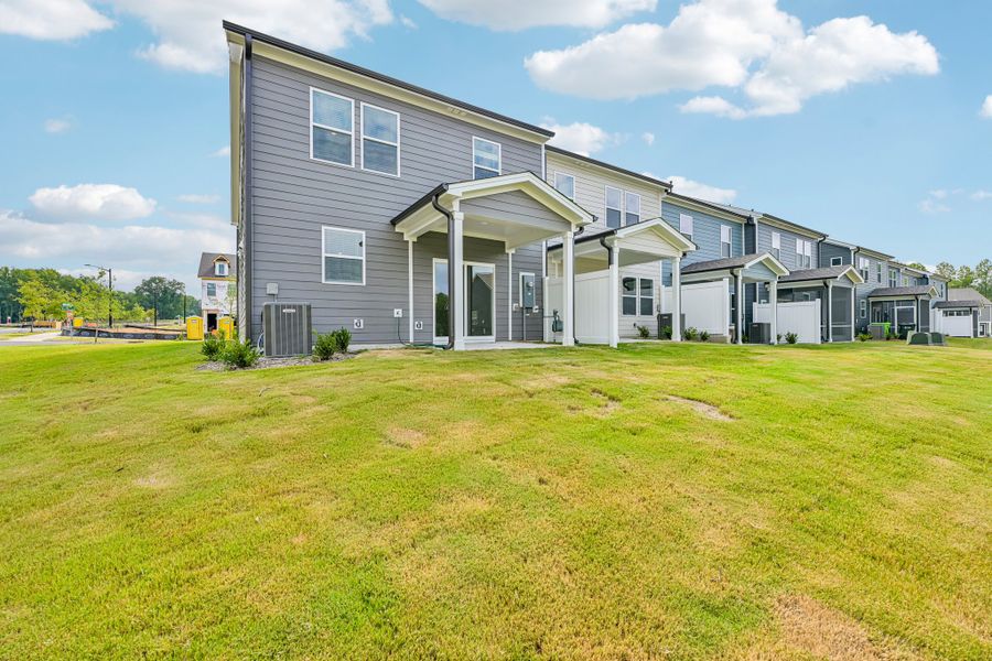 Exterior details and patio area of a home in Forestville Station, Wake Forest (Image 18).