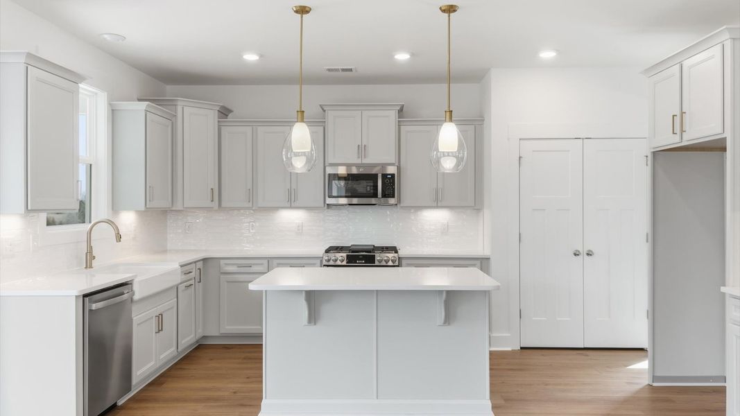 Elegant and compact island anchors this tasteful kitchen with high standards and timeless appeal located in Gray Court, SC