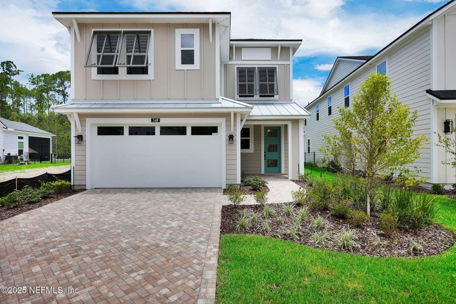 Front exterior of a new home in Reflections at Nocatee, Ponte Vedra, FL, highlighting curb appeal (Image 1).