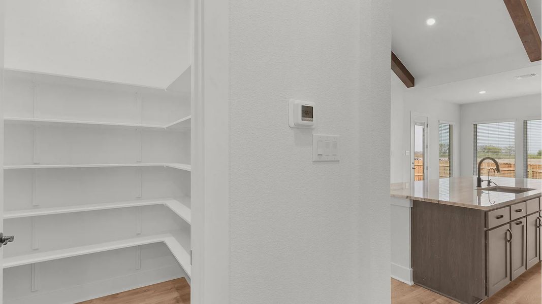 Representative furnished interior of a home built from the Drios by Chesmar Homes in Crescent Bluff, Georgetown (Image 7).