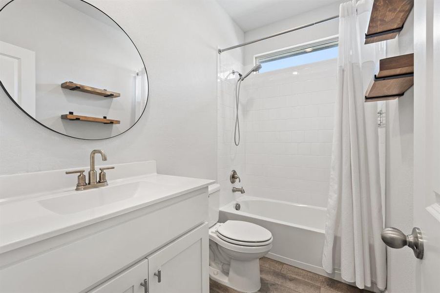 Bathroom with updated hardware and mirror Bathroom with updated hardware and mirror