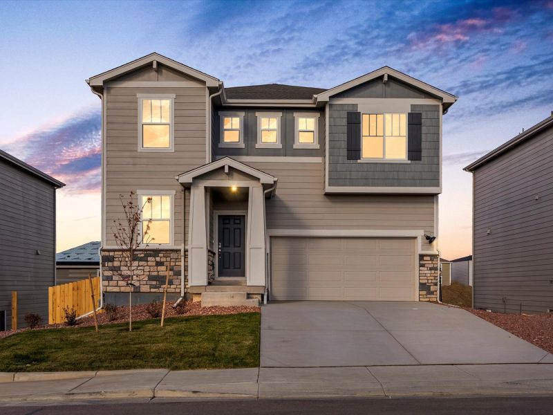 Front exterior of a new home in Lorson Ranch : The Springs Collection, Colorado Springs, CO, highlighting curb appeal (Image 1). Front exterior of a new home in Lorson Ranch : The Springs Collection, Colorado Springs, CO, highlighting curb appeal (Image 1).