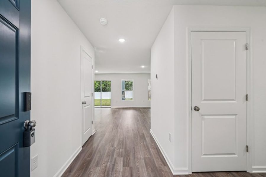 A hallway with white doors.