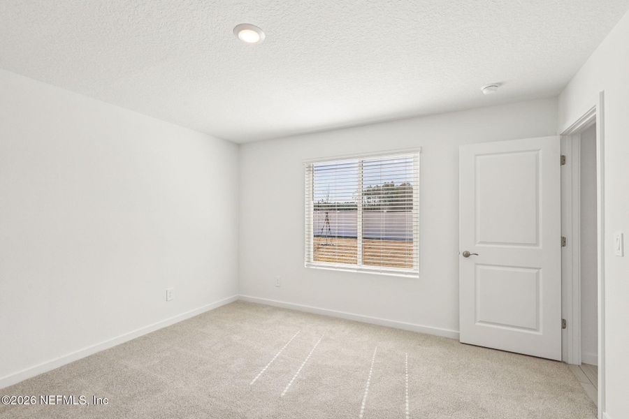 Spacious, unfurnished interior of a new home in Colbert Landings, Palm Coast (Image 31).