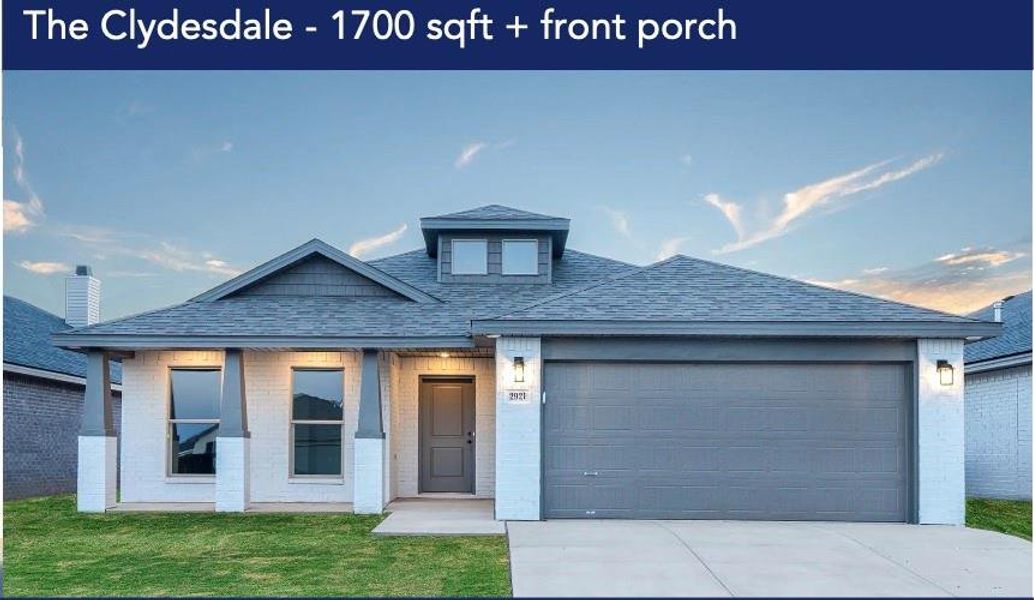 View of front facade featuring a garage and a front yard