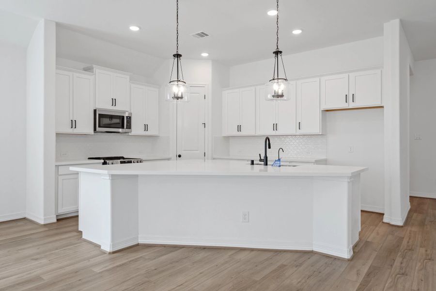 Kitchen. Note: Sample product photo. Actual exterior and interior selections may vary by homesite. Photo may be virtually staged