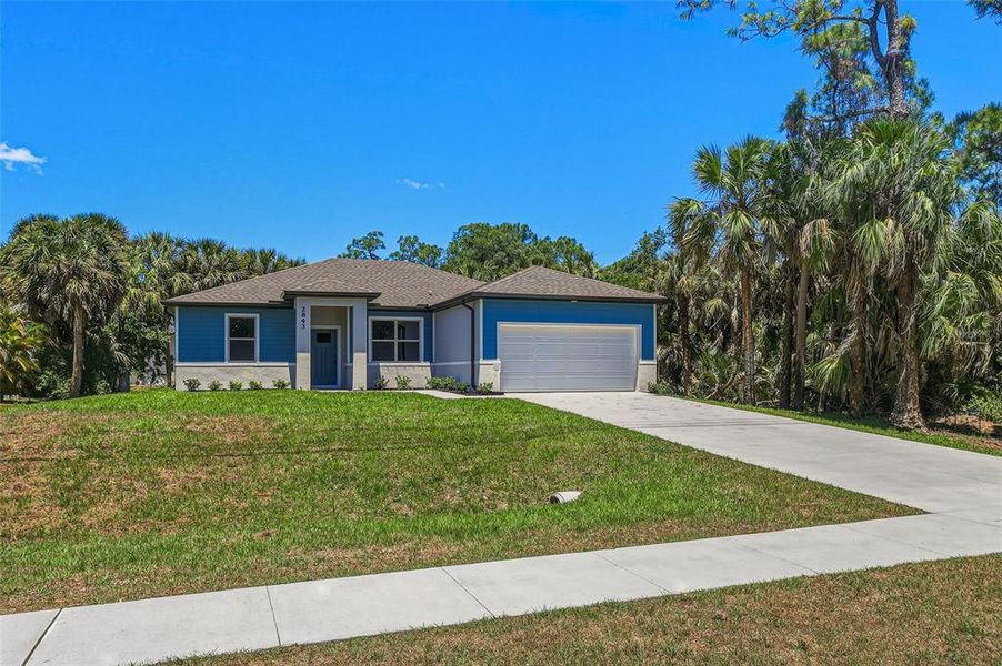 Front exterior of a new home in , North Port, FL, highlighting curb appeal (Image 16). Front exterior of a new home in , North Port, FL, highlighting curb appeal (Image 16).