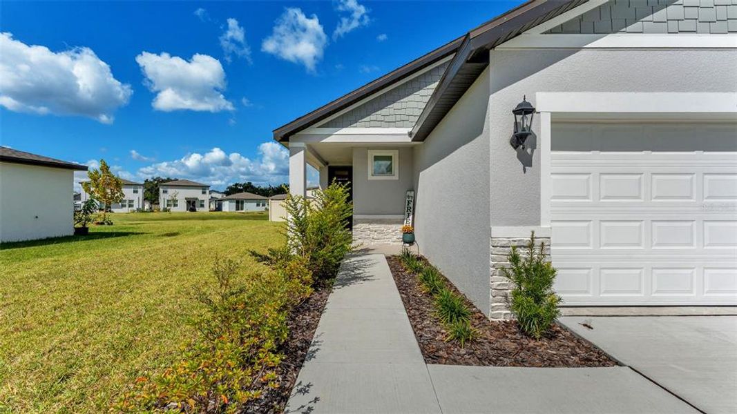 Exterior details and patio area of a home in The Grove at Stuart Crossing - Premier Series, Bartow (Image 4).