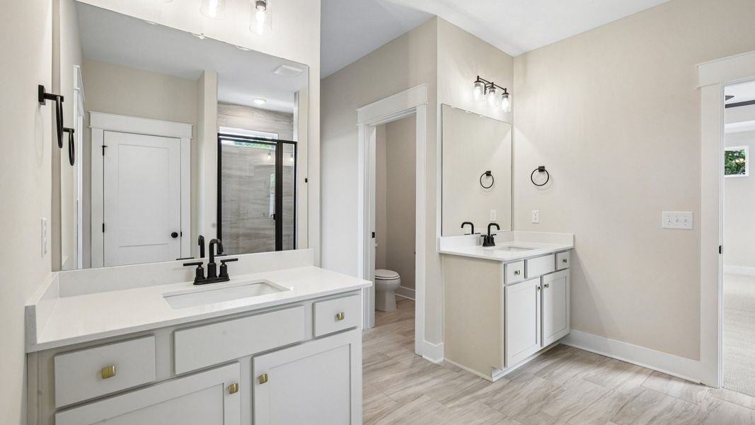 Primary bathroom with dual vanity Primary bathroom with dual vanity