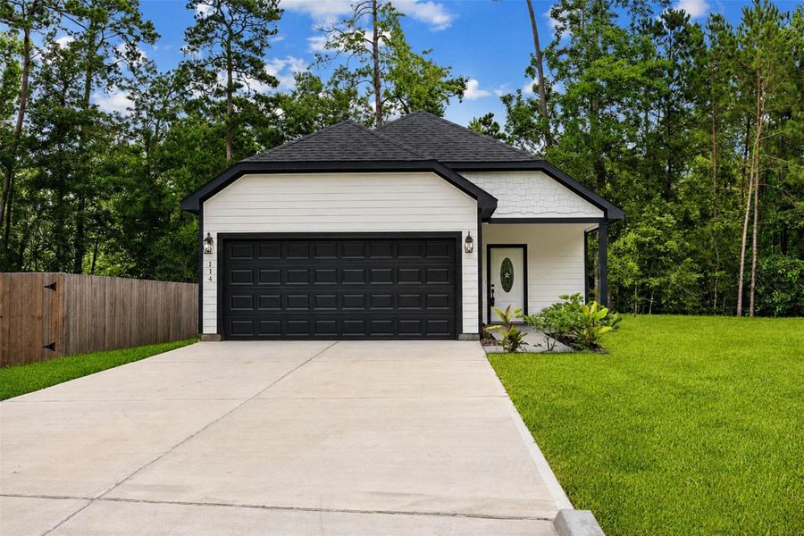 Front exterior of a new home in , Willis, TX, highlighting curb appeal (Image 13).