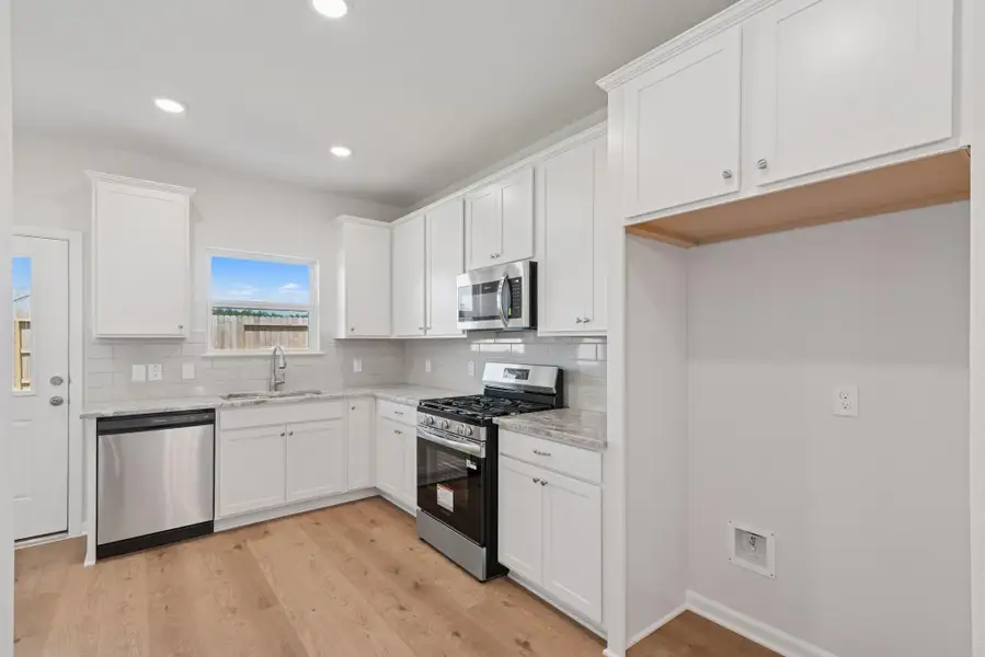 The Blue Jay II- Kitchen. Home under construction. Sample floor plan photo used for illustrative purposes only. Upgrades, selections options, and colors will vary. The Blue Jay II- Kitchen. Home under construction. Sample floor plan photo used for illustrative purposes only. Upgrades, selections options, and colors will vary.