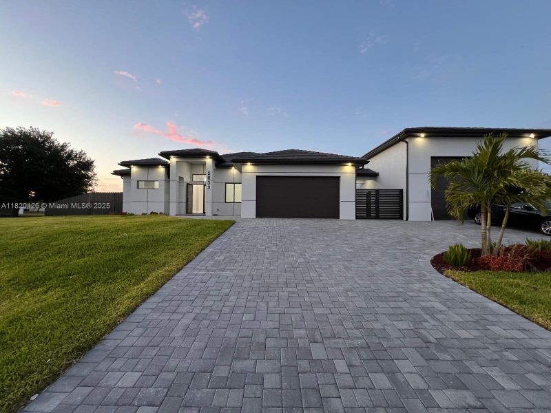Front exterior of a new home in , Cape Coral, FL, highlighting curb appeal (Image 21).