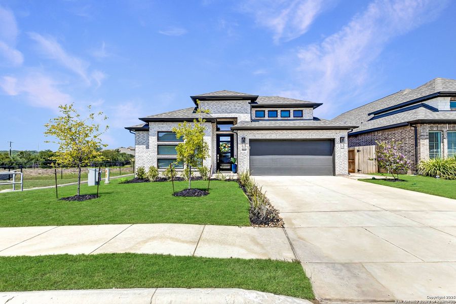 Front exterior of a new home in , Bulverde, TX, highlighting curb appeal (Image 20). Front exterior of a new home in , Bulverde, TX, highlighting curb appeal (Image 20).