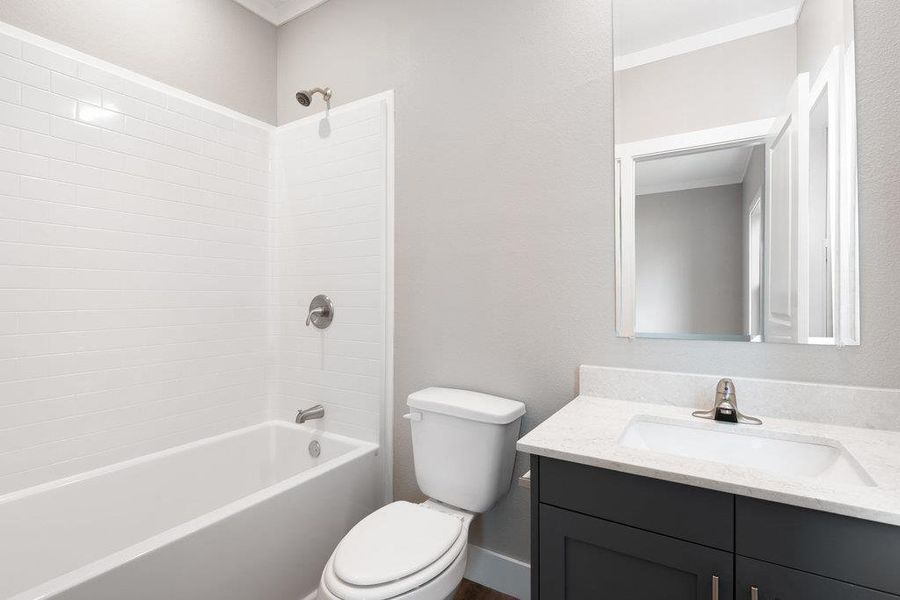 Bathroom featuring vanity and shower / bath combination