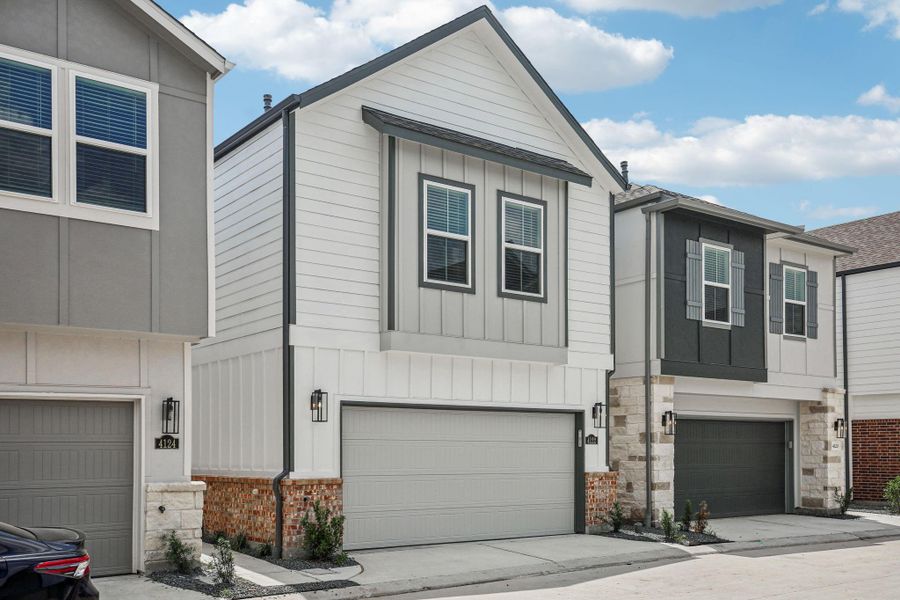 Front exterior of a new home in Spring Brook Village - City Series, Houston, TX, highlighting curb appeal (Image 2). Front exterior of a new home in Spring Brook Village - City Series, Houston, TX, highlighting curb appeal (Image 2).