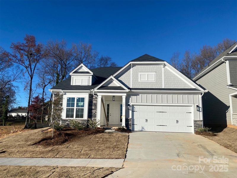 Front exterior of a new home in , Mooresville, NC, highlighting curb appeal (Image 1).