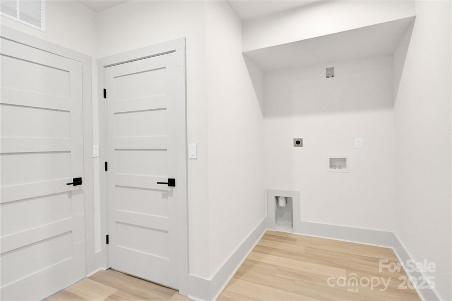 Second laundry room in basement with hookup and additional storage Second laundry room in basement with hookup and additional storage