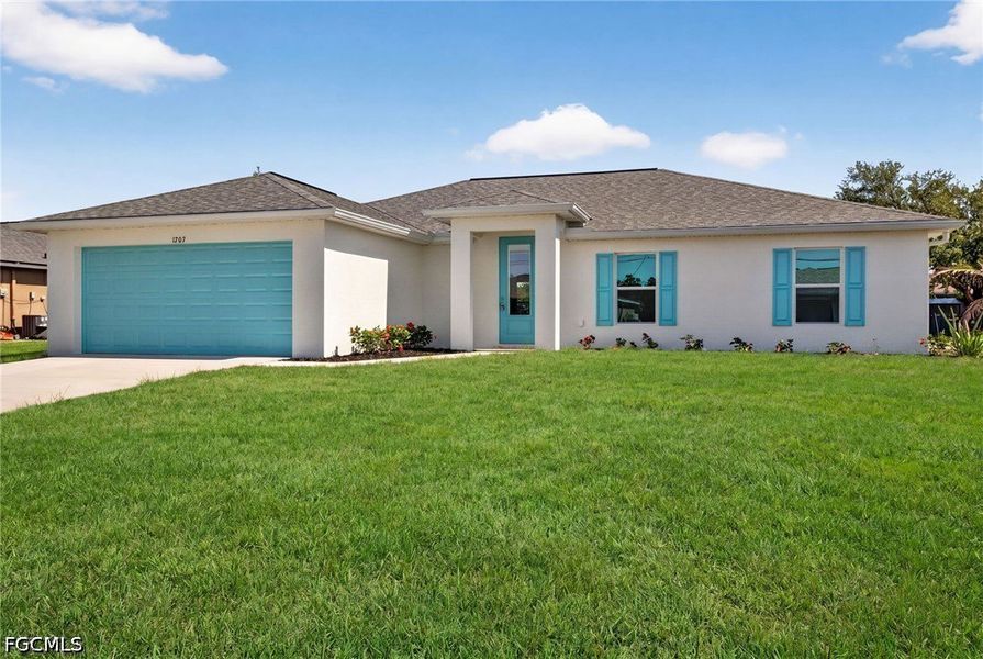 Front exterior of a new home in Cape Coral, Cape Coral, FL, highlighting curb appeal (Image 2). Front exterior of a new home in Cape Coral, Cape Coral, FL, highlighting curb appeal (Image 2).
