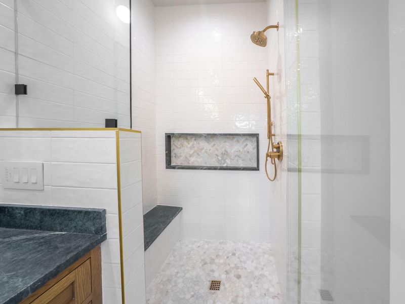 Primary bath's spacious walk-in shower